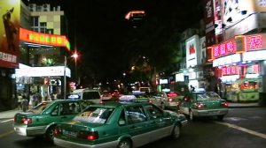 Taxis, downtown Guangzhou at night